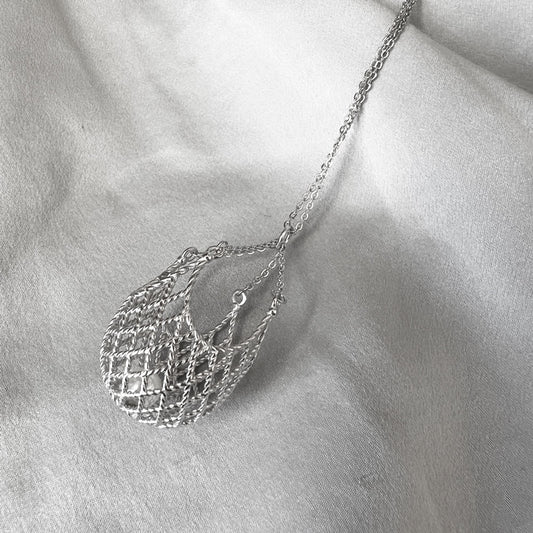 Pearl in a net necklace